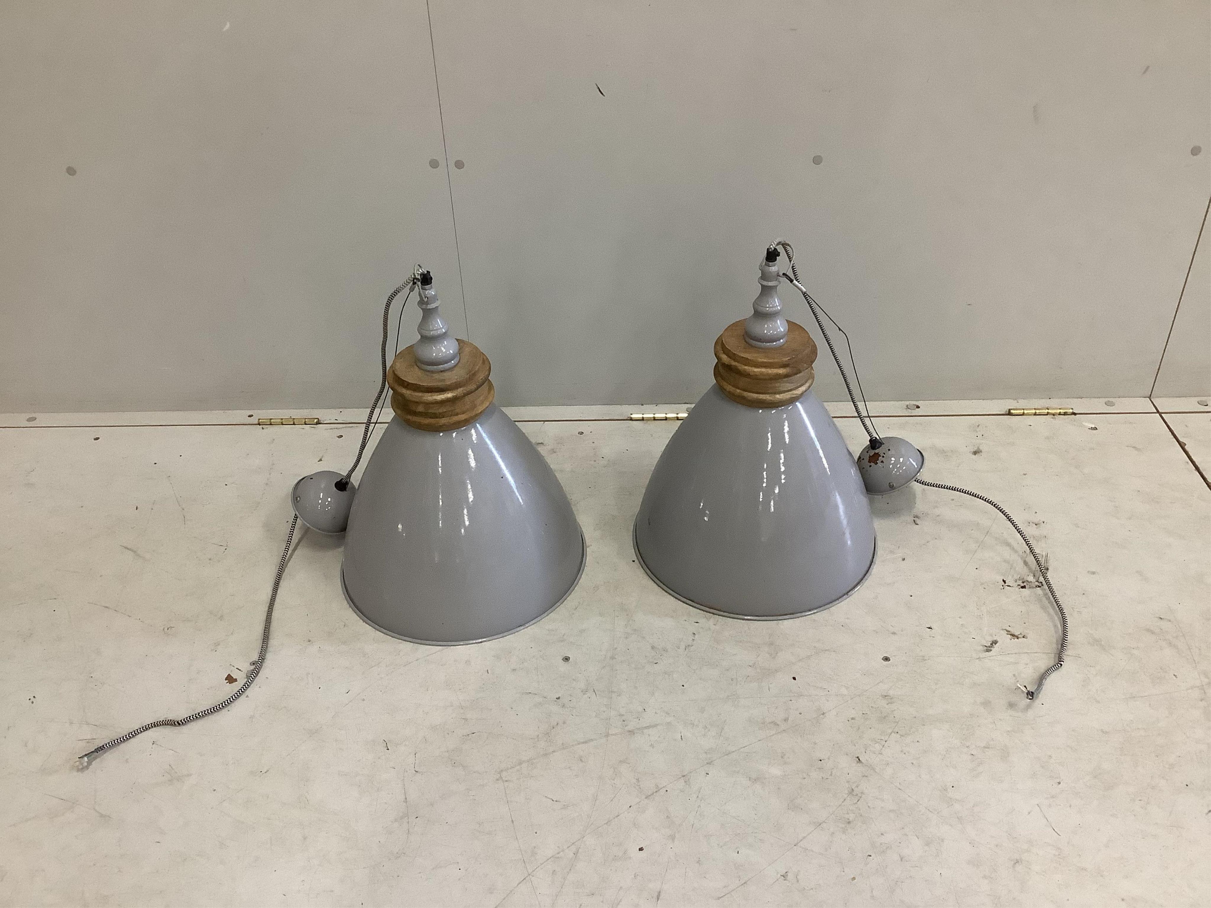 A pair of industrial style ceiling lamps by Barker and Stonehouse, diameter 37cm, height 48cm. Condition - fair to good